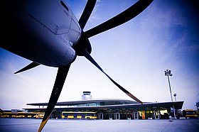 Propeller of aircraft with terminal in the background