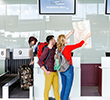 Couple at check-in counter with map